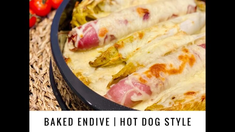 un chien goutant une endive cuite